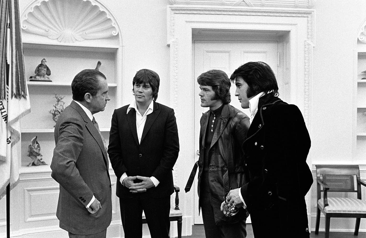 Elvis Presley with two associates and Richard Nixon in the Oval Office in December 1970.