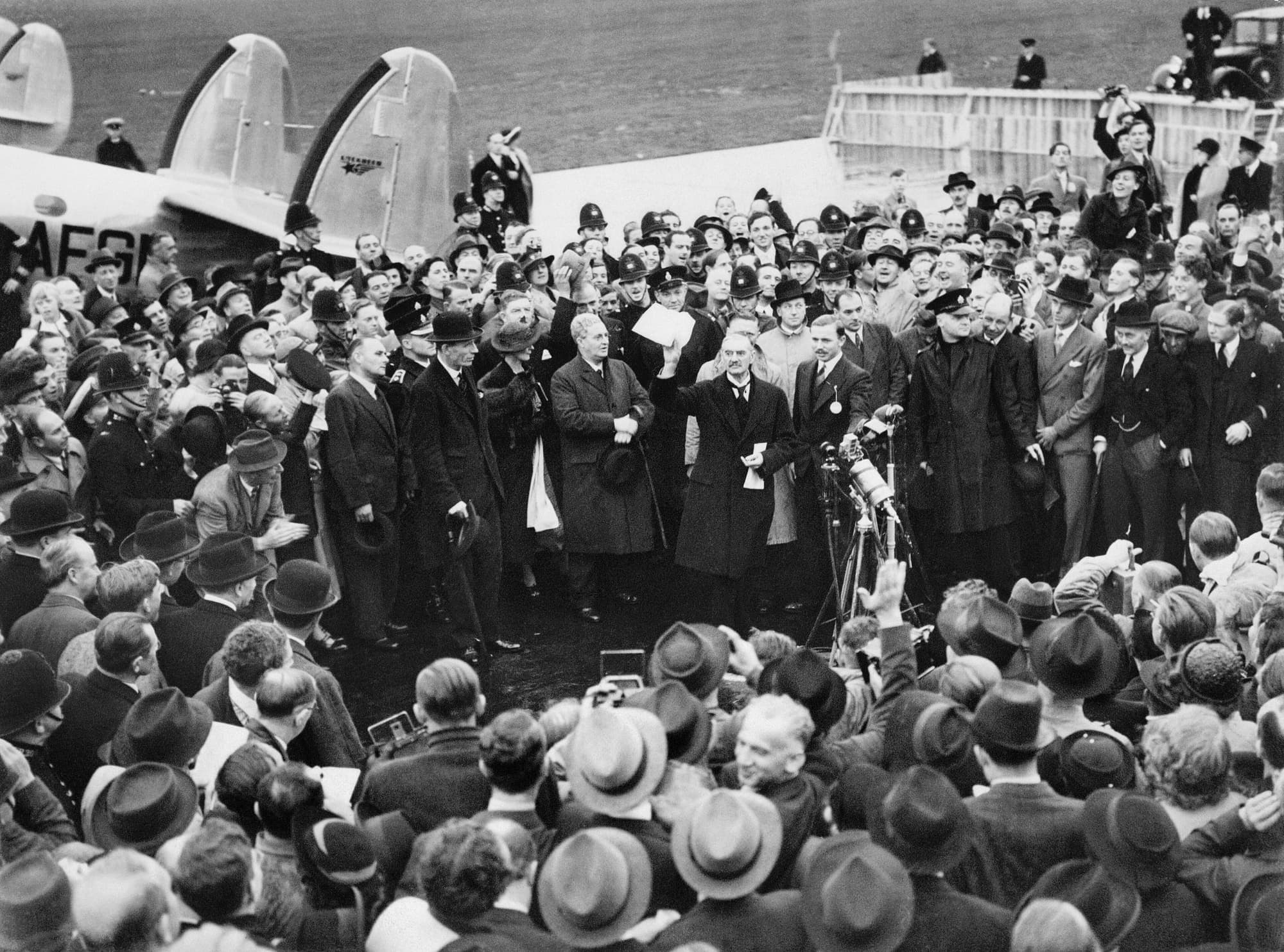 Neville Chamberlain holding up the Anglo-German declaration on his return from Munich in 1938.