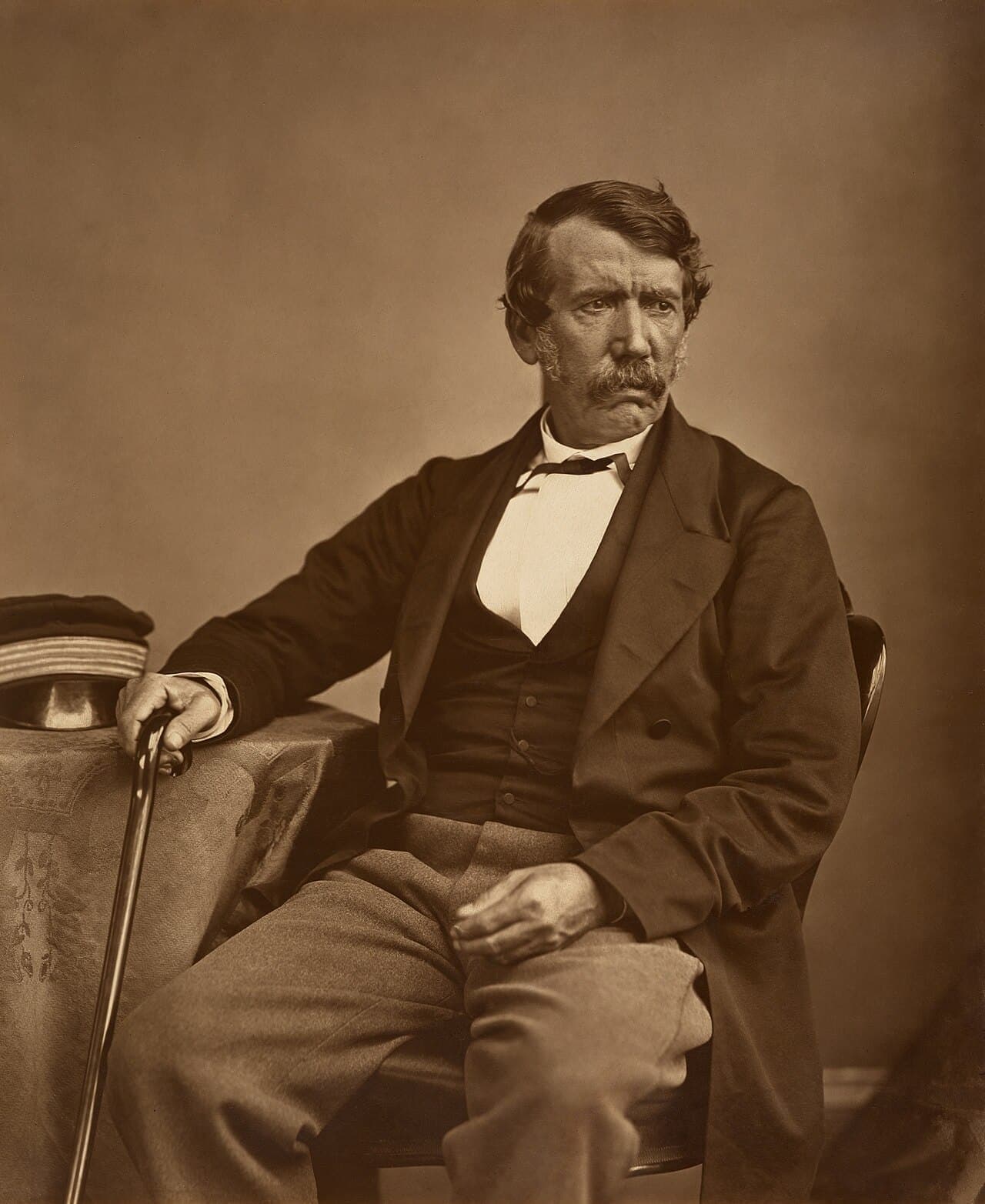 A photographic portrait of David Livingstone, seated, in a dark coat.