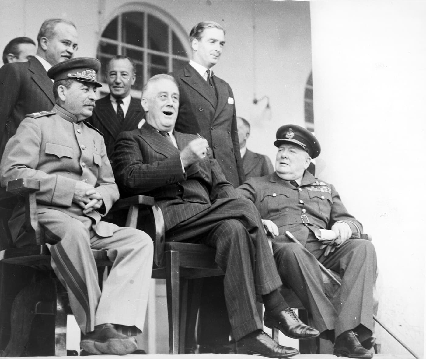 Stalin, Roosevelt and Churchill seated on the portico of the Soviet embassy in Tehran, 1943.