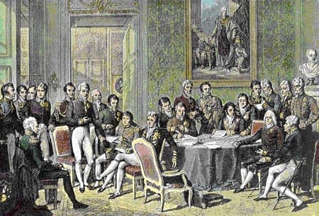 Jean-Baptiste Isabey's engraving of the Congress of Vienna: statesmen and diplomats gathered around a table in a formal chamber, several standing in conversation.
